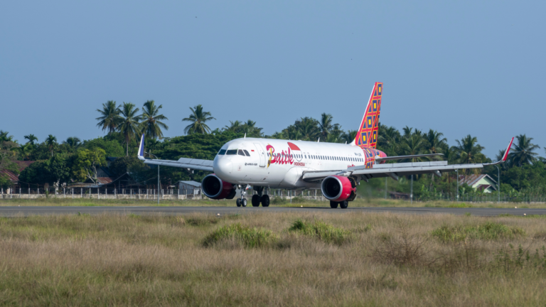 A Batik Air airplane landing on a runway, symbolizing the Indonesian government's initiative for reduced airline fares to enhance travel accessibility during the Eid holidays in 2025.