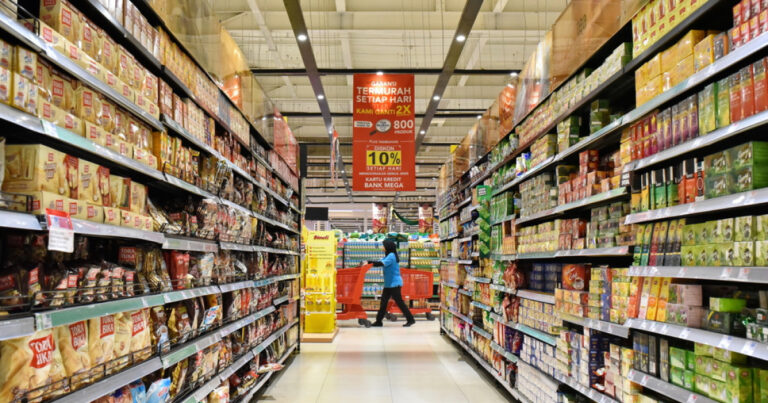 A shopper pushes a cart through a hypermarket aisle in Indonesia, reflecting the impact of Indonesia retail closures.