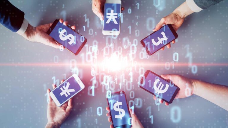 Hands holding smartphones displaying currency symbols, representing global investment in Indonesia fintech lending.