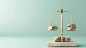 Golden balance scale with stacks of money representing the stable Indonesia inflation rate in 2025.