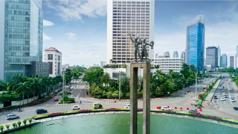 Aerial view of Jakarta’s business district and the Welcome Monument showcasing progress that aligns with strong Jakarta Investment Growth.
