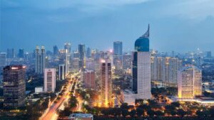 Jakarta skyline at dusk showcasing modern high-rise buildings and major business districts, reflecting strong Indonesia property market growth.