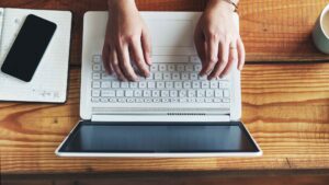 A person working from a cafe symbolizing Indonesia's wfa year end rule